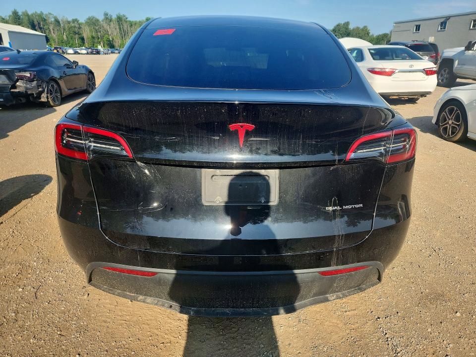 2023 Tesla Model y VIN LRWYGDEE0PC105007 COPART salvage auction — FRONT END, ON - PERMIT NO BRAND - UNFIT, sold $16,950 on 2026-08-18 (photo 6)