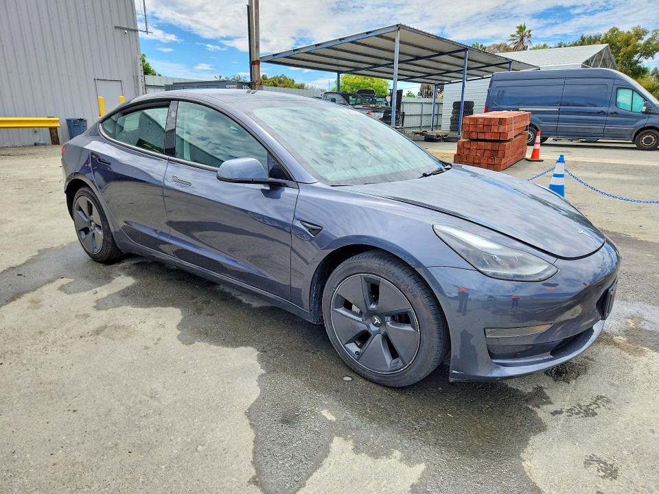 2023 Tesla Model 3 VIN 5YJ3E1EA4PF687985 COPART salvage auction — REAR END, CA - CERTIFICATE OF TITLE (P), sold $17,000 on 2026-07-27 (photo 4)