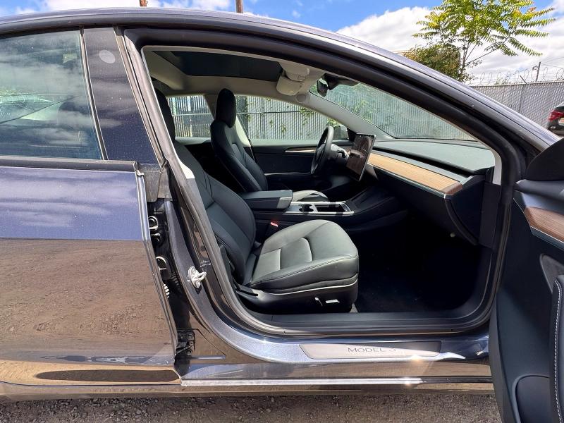 2022 Tesla Model 3 VIN 5YJ3E1EA5NF185418 COPART salvage auction — NORMAL WEAR, OR - CERTIFICATE OF TITLE (P), sold $22,300 on 2026-07-28 (photo 5)
