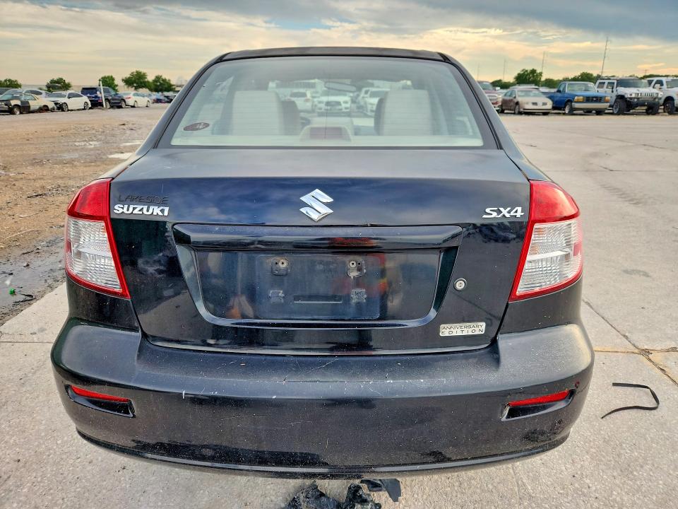 2011 Suzuki Sx4 VIN JS2YC5A21B6303012 COPART salvage auction — MINOR DENT/SCRATCHES, La - Certificate Of Title (P), sold $750 on 2026-07-29 (photo 6)
