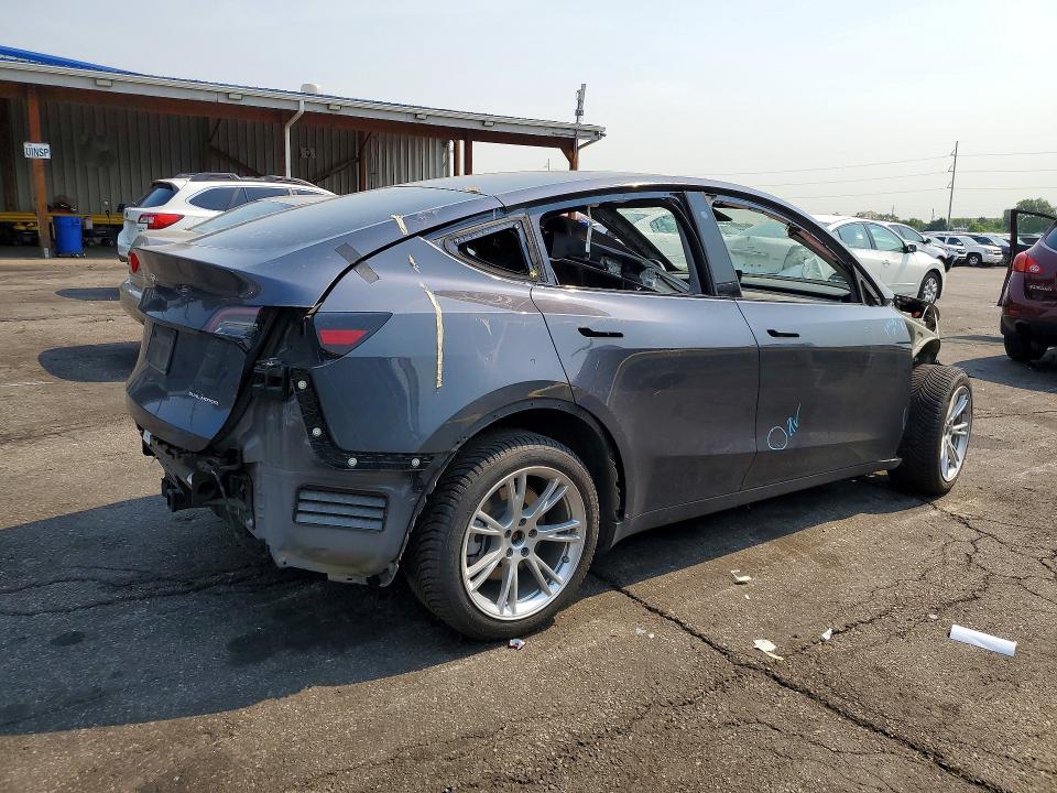 2023 Tesla Model y VIN 7SAYGDEF4PA049300 COPART salvage auction — ALL OVER, TX - DIS/DLR/EXP ONLY CLEAN TITLE (P), sold $7,700 on 2026-07-30 (photo 3)