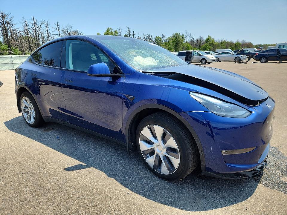 2023 Tesla Model y VIN 7SAYGDEE2PF887397 COPART salvage auction — FRONT END, NY - MV-907A SALVAGE CERTIFICATE, sold $11,500 on 2026-07-27 (photo 4)