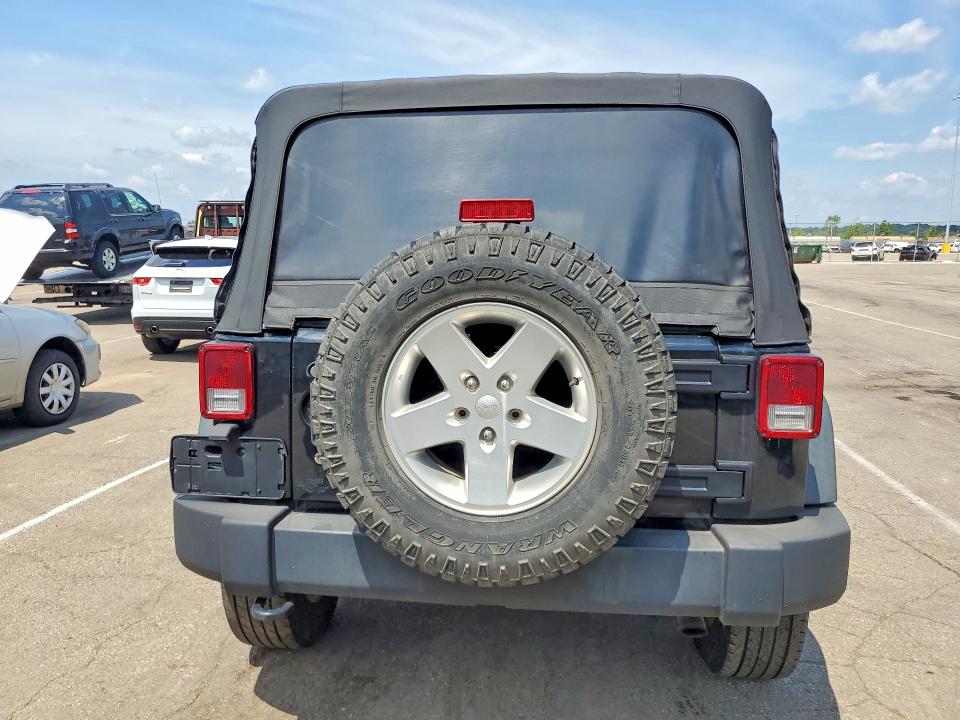 2014 Jeep Wrangler / VIN 1C4BJWDG9EL329091 COPART salvage auction — MINOR DENT/SCRATCHES, Oh - Certificate Of Title (P), sold $1,100 on 2026-09-09 (photo 6)