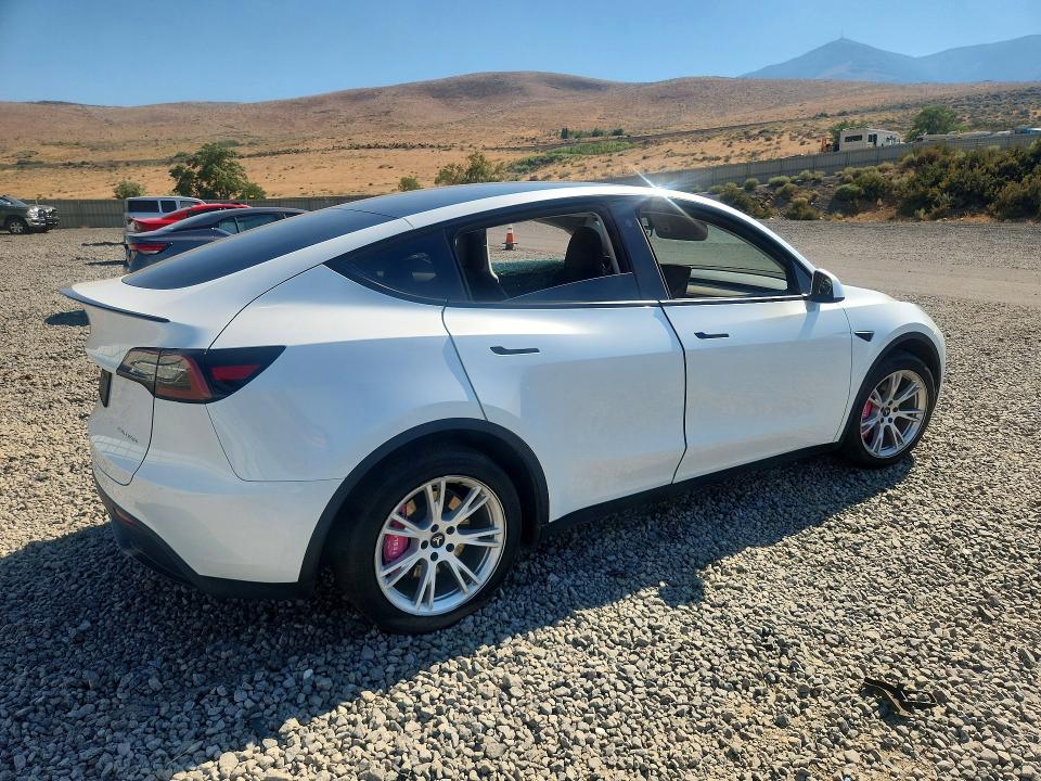 2023 Tesla Model y VIN 7SAYGDEE0PA112691 COPART salvage auction — SIDE, Nv - Salvage Title, sold $11,500 on 2026-08-27 (photo 3)
