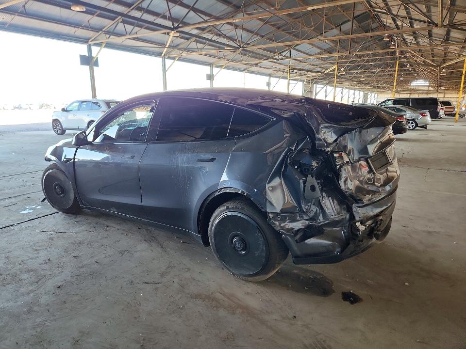 2023 Tesla Model y VIN 7SAYGDEE9PF709423 COPART salvage auction — ALL OVER, AZ - CERT OF TITLE- NON REPAIR, sold $3,050 on 2026-07-27 (photo 2)