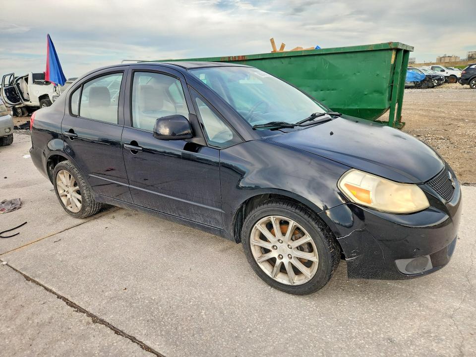 2011 Suzuki Sx4 VIN JS2YC5A21B6303012 COPART salvage auction — MINOR DENT/SCRATCHES, La - Certificate Of Title (P), sold $750 on 2026-07-29 (photo 4)
