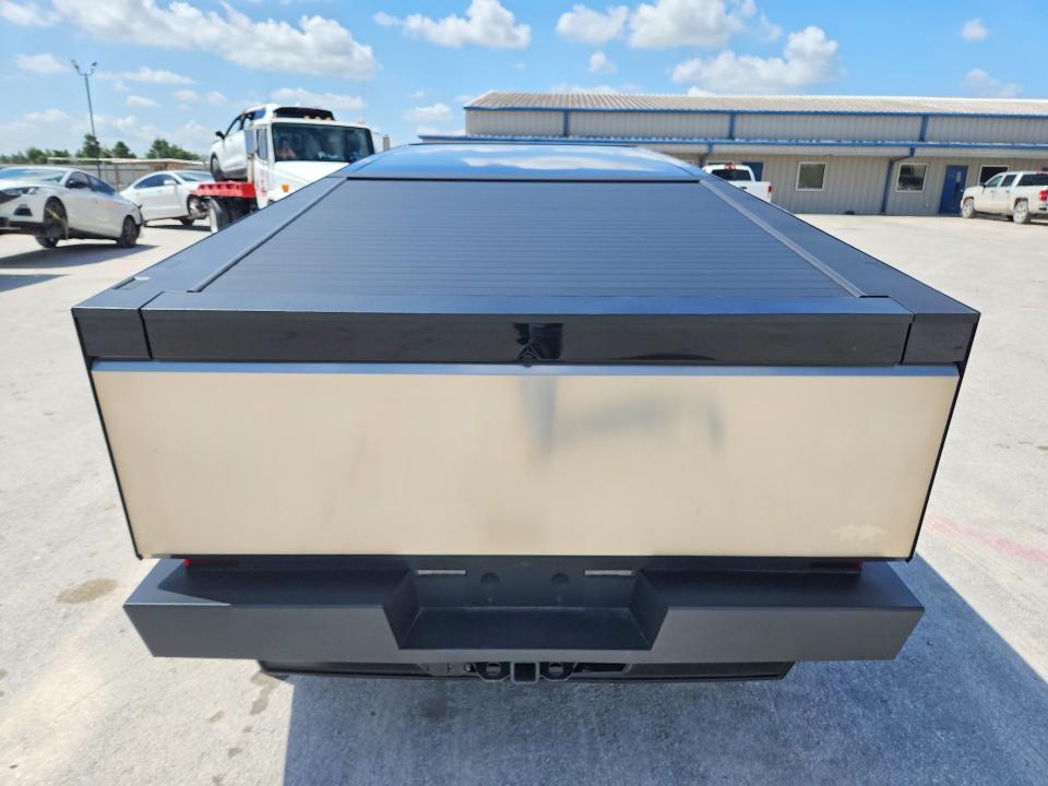 2024 Tesla Cybertruck VIN 7G2CEHEE9RA026641 COPART salvage auction — DAMAGE HISTORY, Tx - Cert Of Title-Rebuilt Salvage (P), sold $40,000 on 2026-07-17 (photo 6)