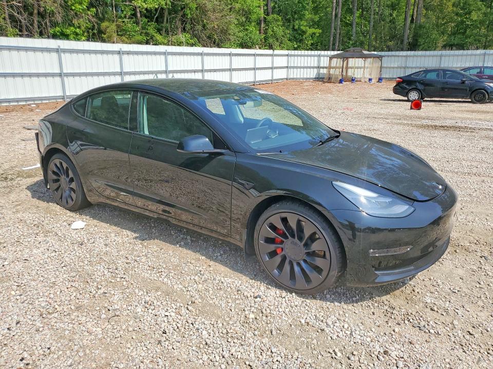 2023 Tesla Model 3 VIN 5YJ3E1EC6PF675483 COPART salvage auction — REAR END, NC - SALVAGE CERTIFICATE OF TITLE, sold $9,100 on 2026-07-31 (photo 4)