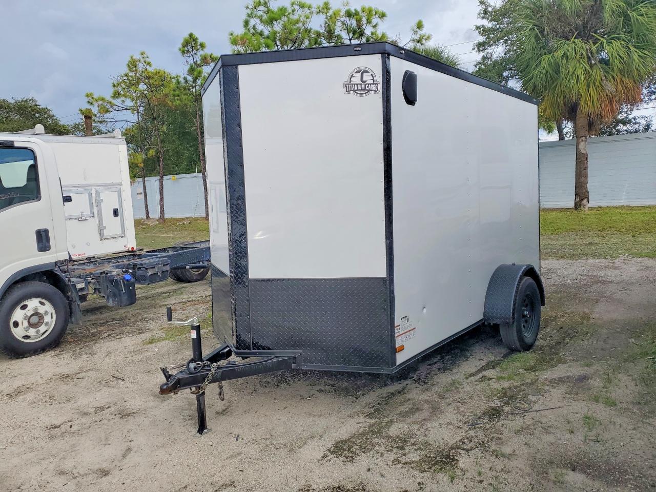 2026 Titanium cargo Trailers VIN 7PLBE1013TM016762 COPART salvage auction — Minor Dent/Scratches, TN - CERTIFICATE OF TITLE (P), sold $525 on 2026-09-15 (photo 1)
