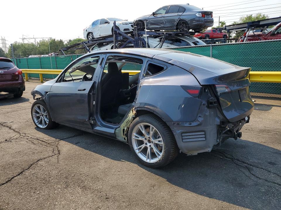 2023 Tesla Model y VIN 7SAYGDEF4PA049300 COPART salvage auction — ALL OVER, TX - DIS/DLR/EXP ONLY CLEAN TITLE (P), sold $7,700 on 2026-07-30 (photo 2)