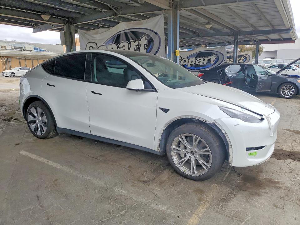 2023 Tesla Model y VIN 7SAYGDEEXPF742575 COPART salvage auction — FRONT END, CA - SALVAGE CERTIFICATE, sold $6,400 on 2026-07-16 (photo 4)