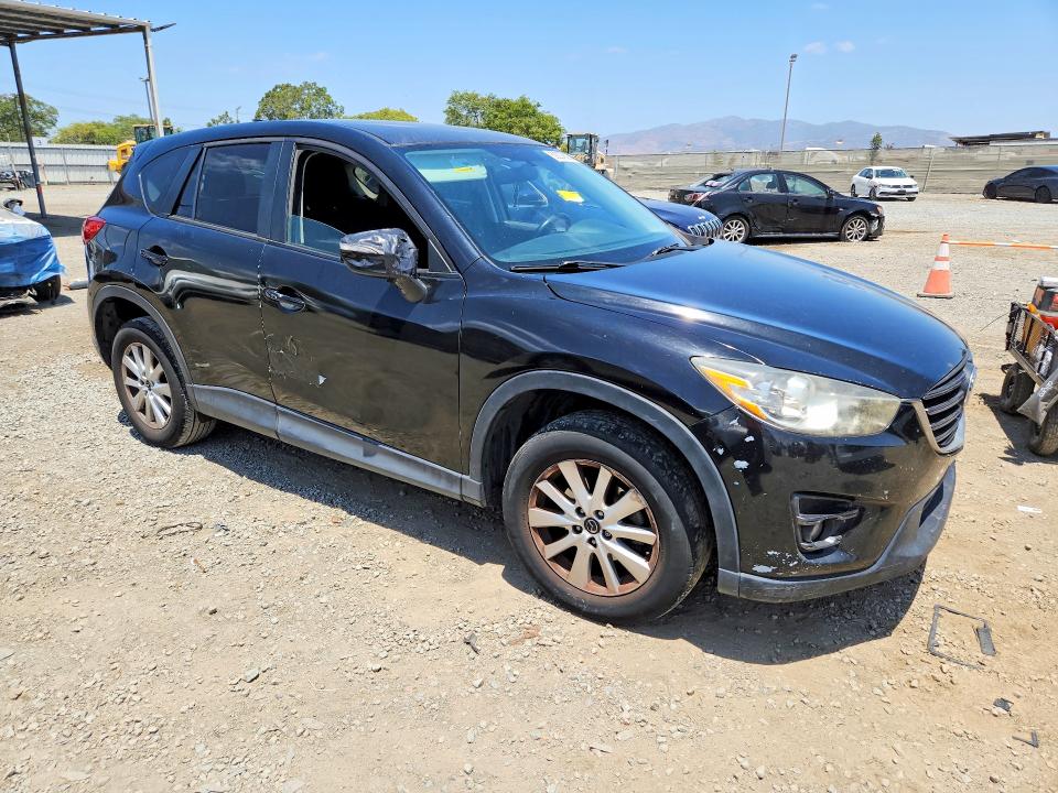 2016 Mazda VIN JM3KE4CY0G0830577 COPART salvage auction — SIDE, Ca - Dis/Dlr/Exp Clean W/Salv Hist, sold $2,350 on 2026-07-07 (photo 4)