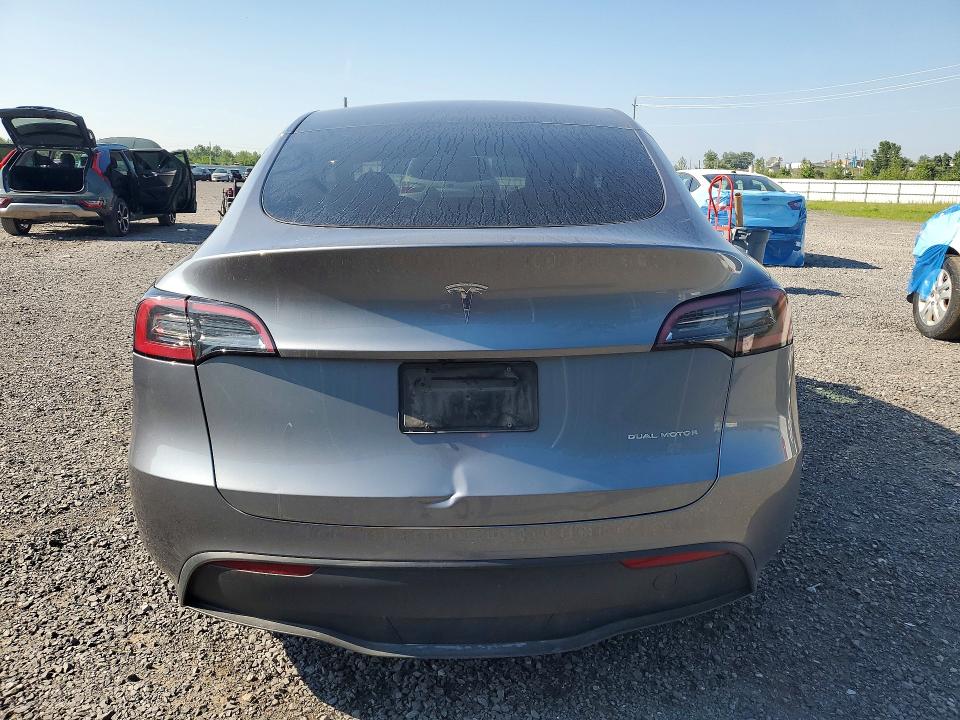 2025 Tesla Model y VIN 7SAYGDEE9SF275268 COPART salvage auction — SIDE, ON - PERMIT NO BRAND - UNFIT, sold $9,500 on 2026-07-23 (photo 6)