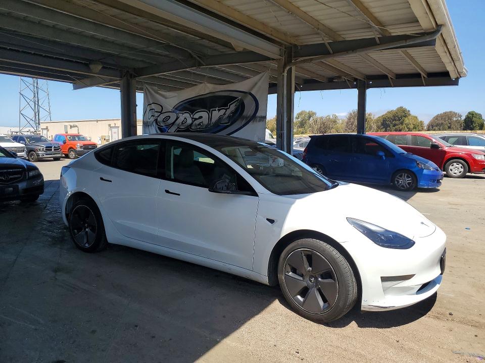 2023 Tesla Model 3 VIN 5YJ3E1EA5PF580153 COPART salvage auction — MINOR DENT/SCRATCHES, CA - CERTIFICATE OF TITLE (P), sold $15,200 on 2026-07-20 (photo 4)