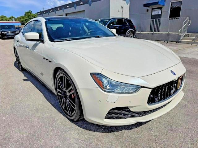 2014 Maserati Ghibli VIN ZAM57RTA9E1086058 COPART salvage auction — MINOR DENT/SCRATCHES, In - Certificate Of Title (P), sold $5,400 on 2026-08-04 (photo 4)