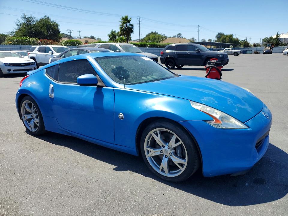 2011 Nissan 370z VIN JN1AZ4EHXBM551762 COPART salvage auction — VANDALISM, Fl - Dis/Dlr/Exp Only Salvage Title, sold $5,100 on 2026-07-28 (photo 4)