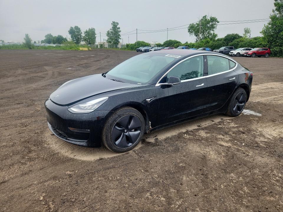 2018 Tesla Model 3 VIN 5YJ3E1EA7JF095617 COPART salvage auction — MINOR DENT/SCRATCHES, Qc - Aucune Mention, sold $9,300 on 2026-07-29 (photo 1)