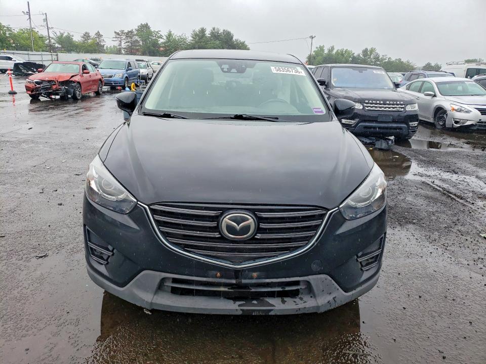 2016 Mazda VIN JM3KE4DY5G0909760 COPART salvage auction — SIDE, CT - CERT OF TITLE-SALVAGE, sold $3,550 on 2026-07-10 (photo 5)