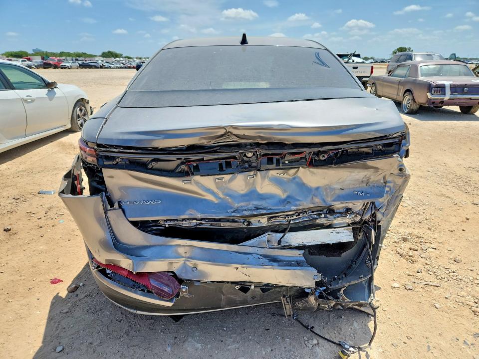 2026 Toyota Crown signia VIN JTDAAAAF9T3040350 COPART salvage auction — SIDE, Tx - Salvage Vehicle Title, sold $16,200 on 2026-08-27 (photo 6)