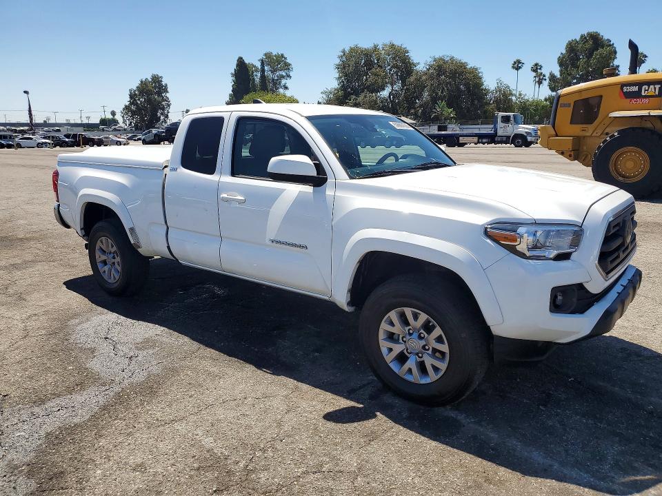 2018 Toyota Tacoma VIN 5TFSZ5AN8JX123088 COPART salvage auction — MINOR DENT/SCRATCHES, Fl - Dis/Dlr/Exp Only Clean Title (P), sold $10,200 on 2026-07-21 (photo 4)