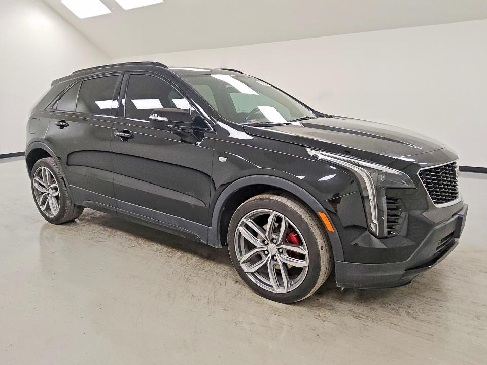 2021 Cadillac Xt4 VIN 1GYFZER40MF001004 COPART salvage auction — MINOR DENT/SCRATCHES, TX - CERTIFICATE OF TITLE, sold $11,400 on 2026-08-20 (photo 4)