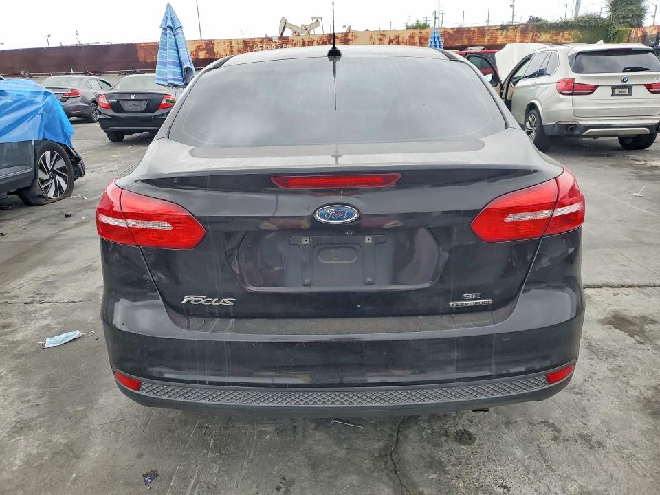2016 Ford Focus VIN 1FADP3F21GL291243 COPART salvage auction — NORMAL WEAR, Ca - Dis/Dlr/Exp Only Clean Title, sold $375 on 2026-07-10 (photo 6)