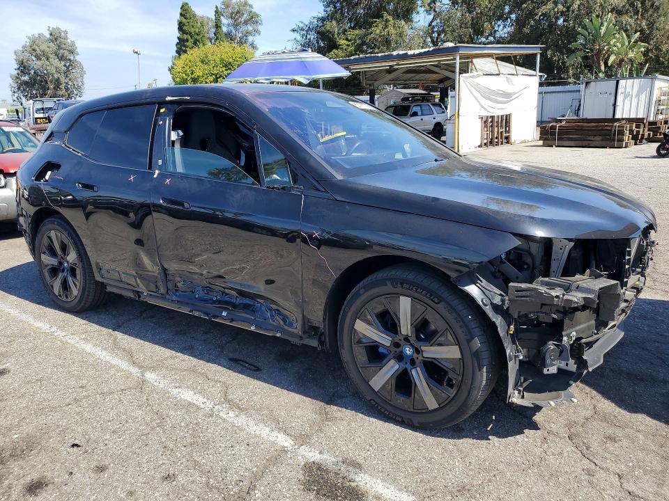 2024 BMW Ix VIN WB523CF05RCR12168 COPART salvage auction — SIDE, CA - SALVAGE CERTIFICATE, sold $20,200 on 2026-08-28 (photo 4)