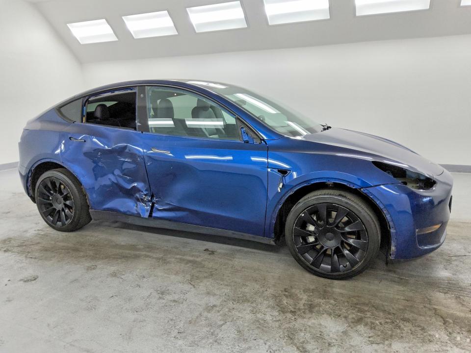 2022 Tesla Model y VIN 7SAYGDEE3NF481237 COPART salvage auction — SIDE, NV - CERTIFICATE OF TITLE, sold $9,700 on 2026-07-20 (photo 4)