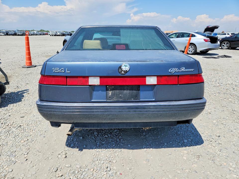 1991 Alfa romeo 164 VIN ZAREA43L5M6186854 COPART salvage auction — FRONT END, CO - DIS/DLR/EXP ONLY CLEAN TITLE, sold $275 on 2026-08-06 (photo 6)
