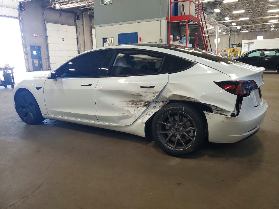 2023 Tesla Model 3 VIN 5YJ3E1EA9PF580382 COPART salvage auction — SIDE, MN - CERT OF TITLE-SALVAGE, sold $8,200 on 2026-09-01 (photo 2)