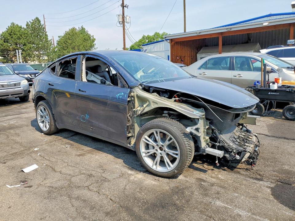 2023 Tesla Model y VIN 7SAYGDEF4PA049300 COPART salvage auction — ALL OVER, TX - DIS/DLR/EXP ONLY CLEAN TITLE (P), sold $7,700 on 2026-07-30 (photo 4)