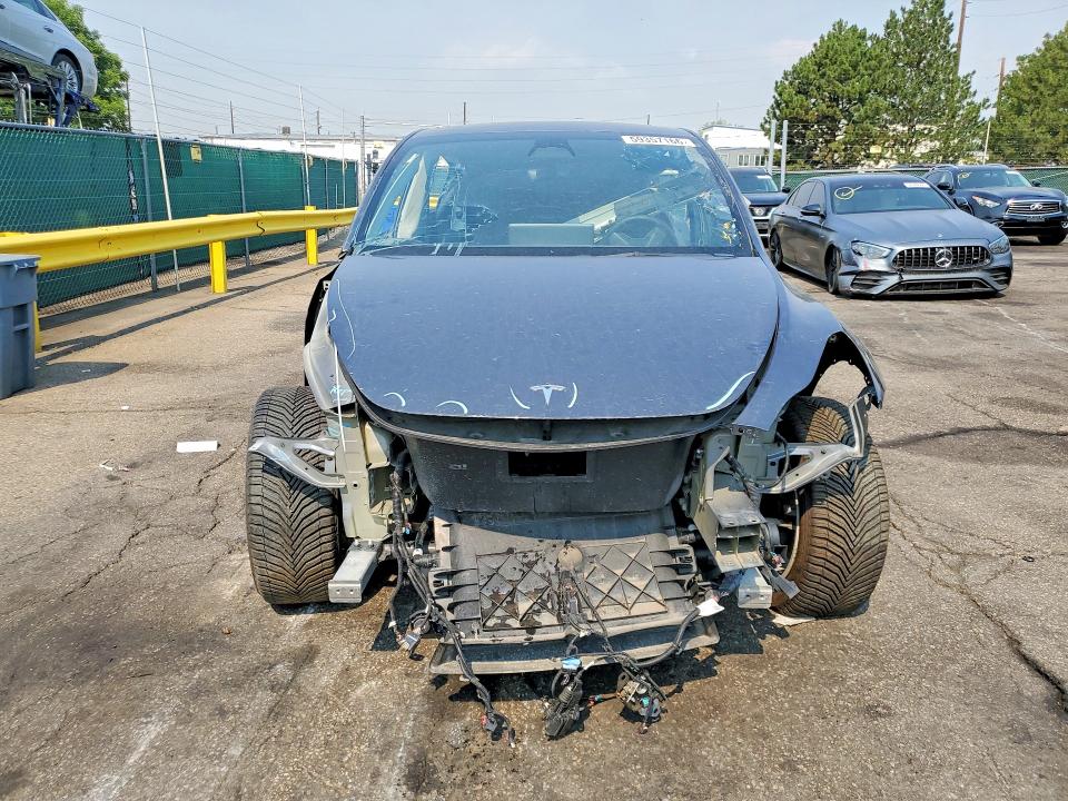 2023 Tesla Model y VIN 7SAYGDEF4PA049300 COPART salvage auction — ALL OVER, TX - DIS/DLR/EXP ONLY CLEAN TITLE (P), sold $7,700 on 2026-07-30 (photo 5)