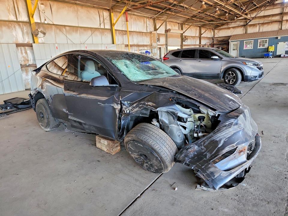 2023 Tesla Model y VIN 7SAYGDEE9PF709423 COPART salvage auction — ALL OVER, AZ - CERT OF TITLE- NON REPAIR, sold $3,050 on 2026-07-27 (photo 4)