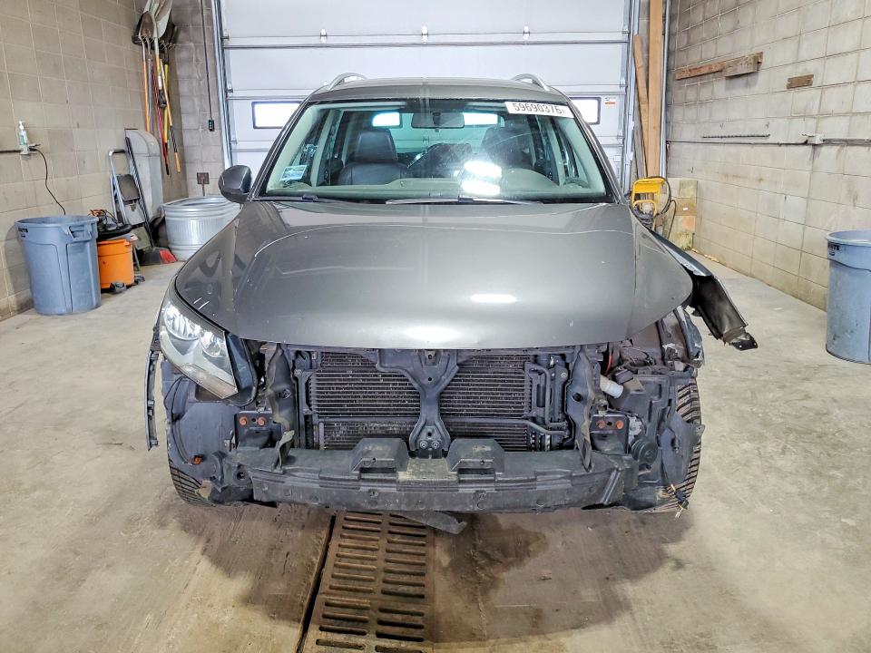 2014 Volkswagen Tiguan VIN WVGBV3AX1EW536530 COPART salvage auction — FRONT END, MN - CERT OF TITLE-PRIOR SALVAGE, sold $525 on 2026-08-06 (photo 5)