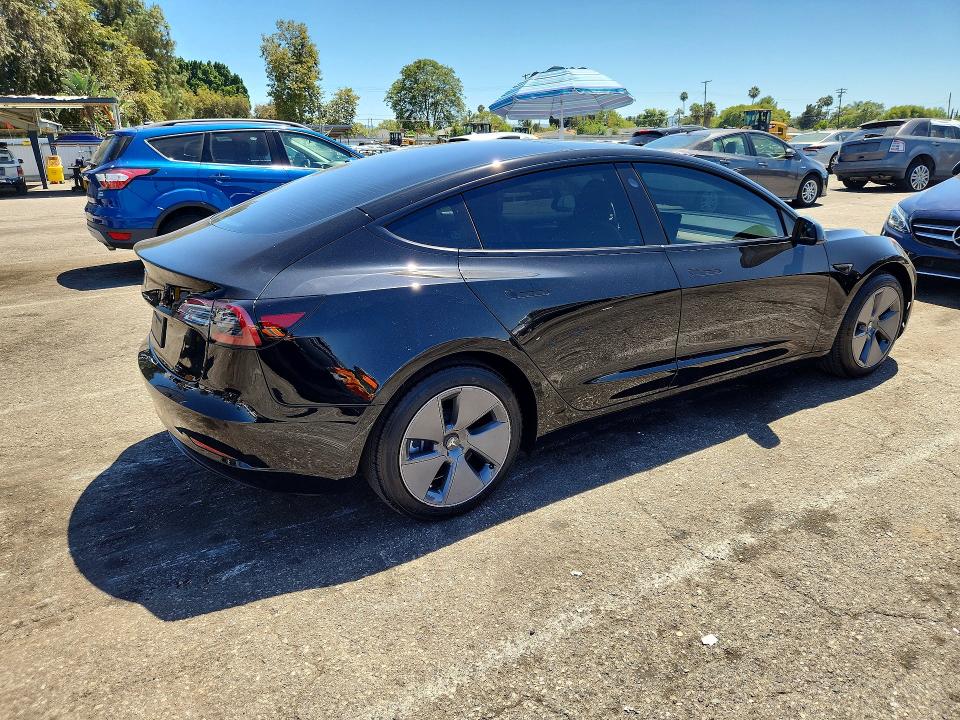2023 Tesla Model 3 VIN 5YJ3E1EA7PF698947 COPART salvage auction — NORMAL WEAR, Ca - Salvage Certificate (P), sold $13,700 on 2026-07-24 (photo 3)