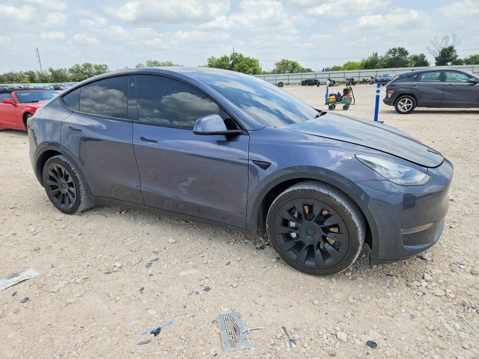 2021 Tesla Model y VIN 5YJYGDEE9MF149038 COPART salvage auction — NORMAL WEAR, TX - CERT OF TITLE-REBUILT SALVAGE, sold $9,900 on 2026-08-03 (photo 4)