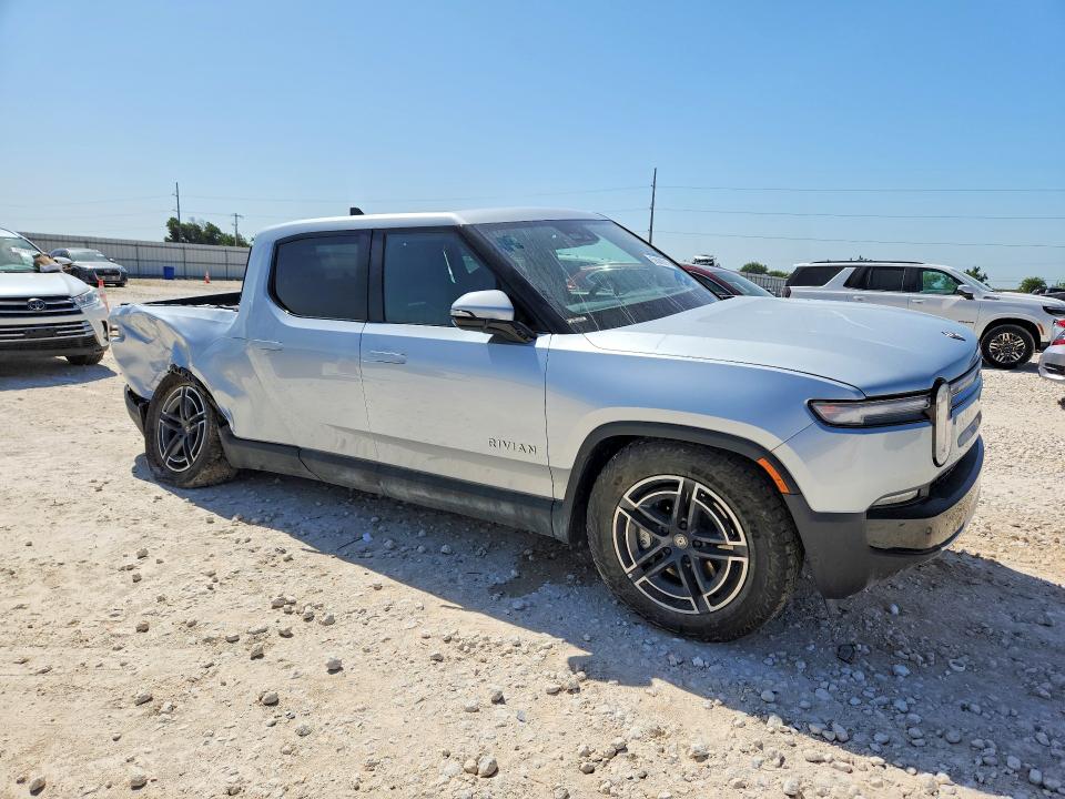 2025 Rivian R1t VIN 7FCTGBAA8SN035090 COPART salvage auction — REAR END, TX - SALVAGE VEHICLE TITLE (P), sold $17,700 on 2026-08-13 (photo 4)