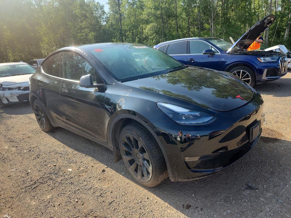 2023 Tesla Model y VIN LRWYGDEE0PC105007 COPART salvage auction — FRONT END, ON - PERMIT NO BRAND - UNFIT, sold $16,950 on 2026-08-18 (photo 4)