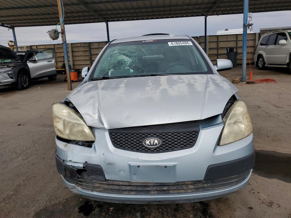 2009 Kia Rio VIN KNADE223X96451207 COPART salvage auction — FRONT END, TX - SALVAGE VEHICLE TITLE (P), sold $125 on 2026-07-31 (photo 5)