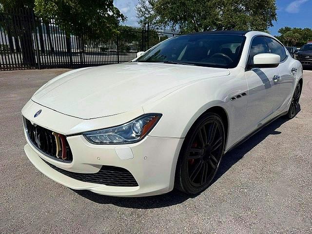 2014 Maserati Ghibli VIN ZAM57RTA9E1086058 COPART salvage auction — MINOR DENT/SCRATCHES, In - Certificate Of Title (P), sold $5,400 on 2026-08-04 (photo 1)