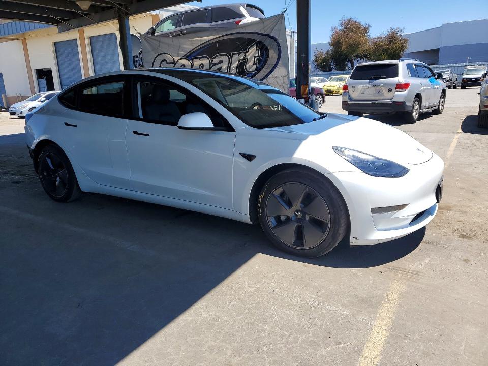 2023 Tesla Model 3 VIN 5YJ3E1EA7PF541256 COPART salvage auction — REAR END, CA - CERTIFICATE OF TITLE (P), sold $14,600 on 2026-07-13 (photo 4)