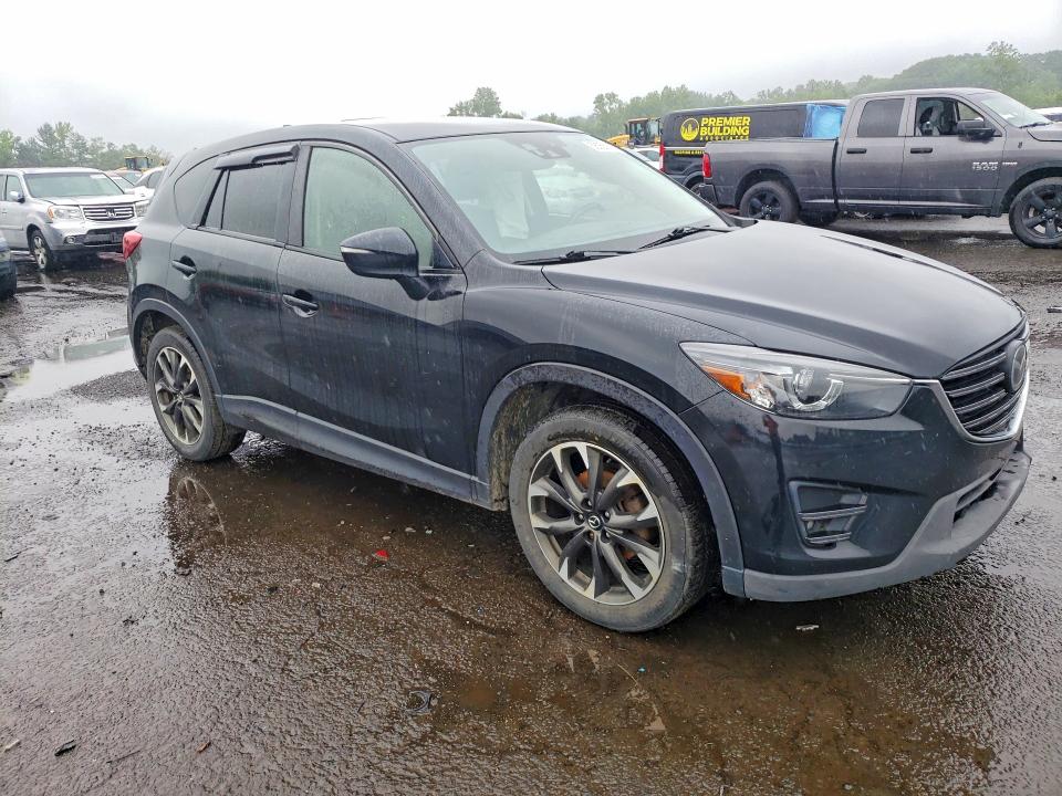 2016 Mazda VIN JM3KE4DY5G0909760 COPART salvage auction — SIDE, CT - CERT OF TITLE-SALVAGE, sold $3,550 on 2026-07-10 (photo 4)