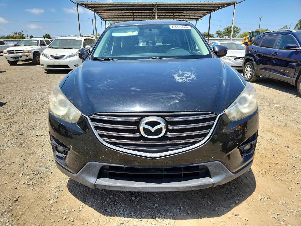2016 Mazda VIN JM3KE4CY0G0830577 COPART salvage auction — SIDE, Ca - Dis/Dlr/Exp Clean W/Salv Hist, sold $2,350 on 2026-07-07 (photo 5)