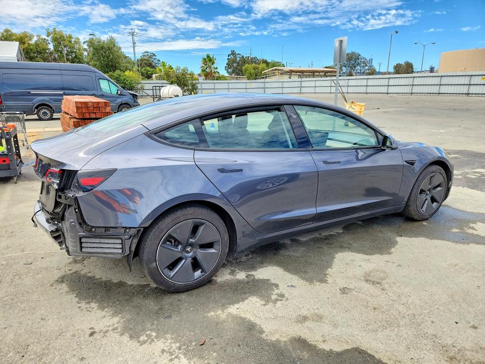 2023 Tesla Model 3 VIN 5YJ3E1EA4PF687985 COPART salvage auction — REAR END, CA - CERTIFICATE OF TITLE (P), sold $17,000 on 2026-07-27 (photo 3)