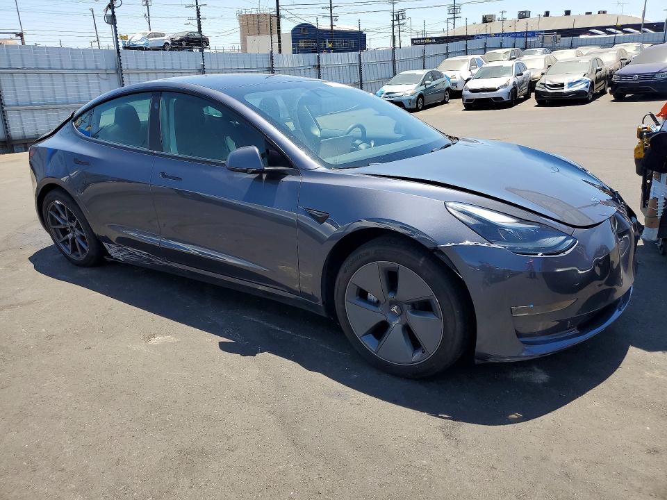 2023 Tesla Model 3 VIN 5YJ3E1EA0PF712946 COPART salvage auction — REAR END, CA - SALVAGE CERTIFICATE, sold $6,400 on 2026-07-29 (photo 4)