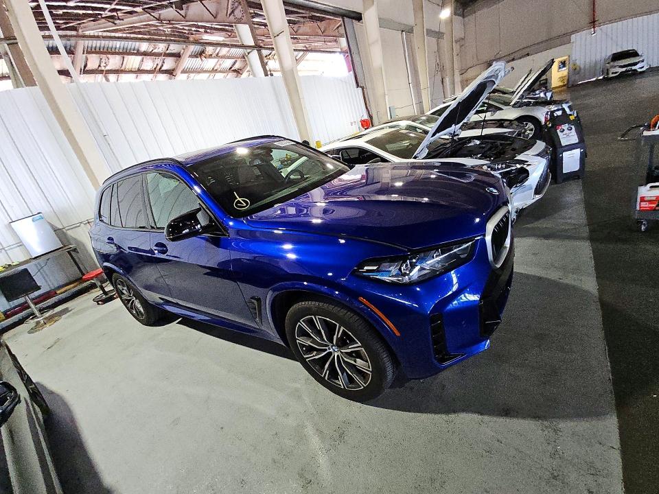 2026 BMW X5 VIN 5UX33EU04T9018947 COPART salvage auction — NORMAL WEAR, Wi - Dis/Dlr/Exp Only Clean Title, sold $45,500 on 2026-07-30 (photo 4)