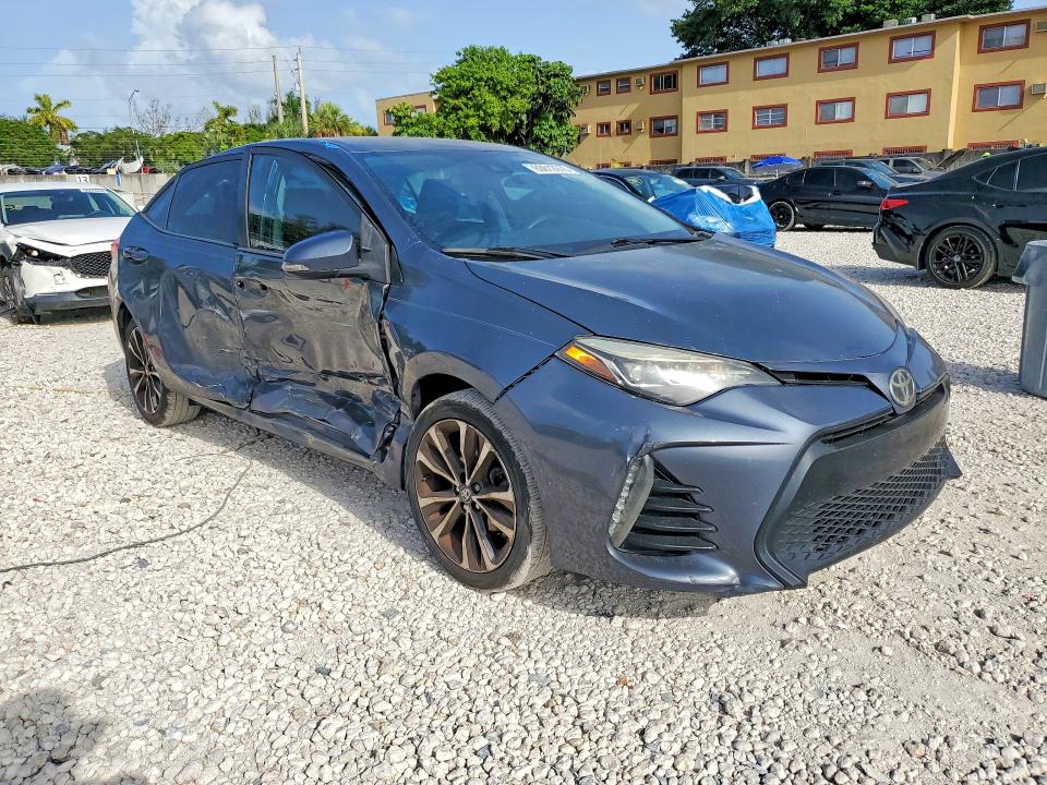 2017 Toyota Corolla VIN 5YFBURHE8HP616757 COPART salvage auction — SIDE, Fl - Cert Of Title Slvg Rebuildable, sold $2,100 on 2026-07-28 (photo 4)