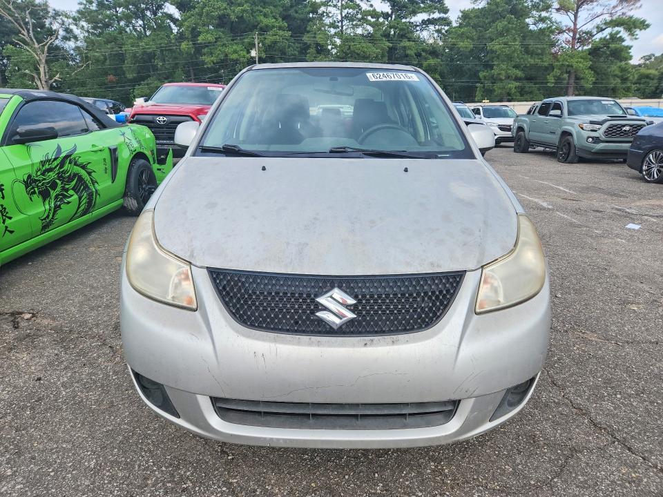 2011 Suzuki Sx4 VIN JS2YC5A26B6300770 COPART salvage auction — MINOR DENT/SCRATCHES, Al - Cert Of Title-Salvage Title, sold $225 on 2026-09-28 (photo 5)