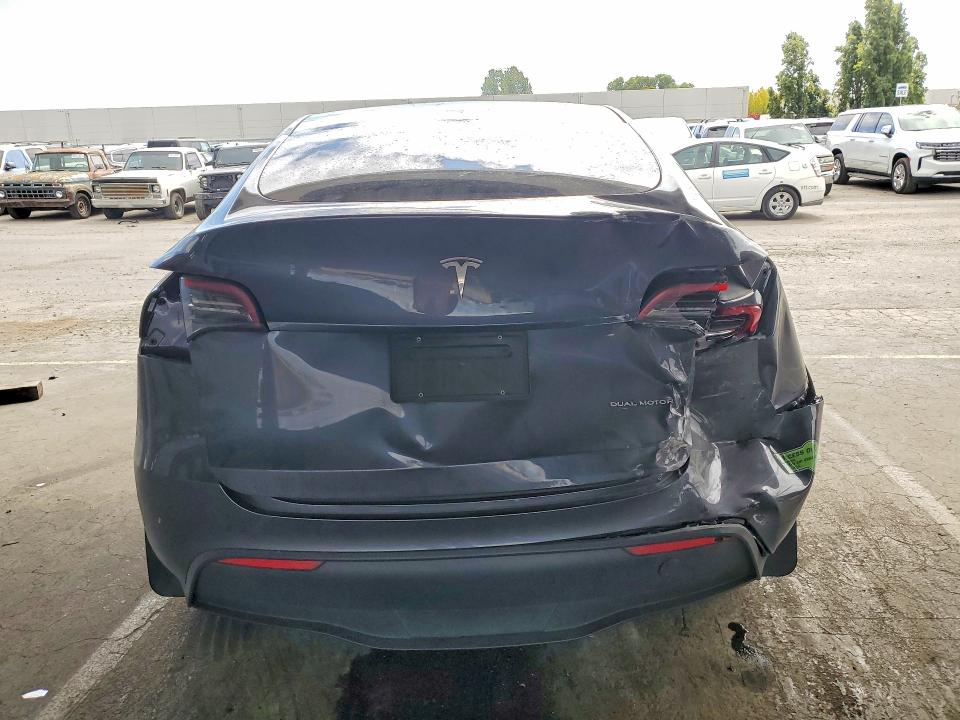 2023 Tesla Model y VIN 7SAYGDEE5PF635305 COPART salvage auction — REAR END, Ca - Salvage Certificate, sold $7,600 on 2026-07-14 (photo 6)