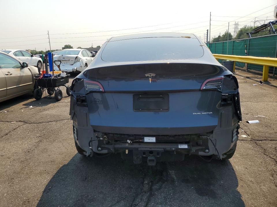2023 Tesla Model y VIN 7SAYGDEF4PA049300 COPART salvage auction — ALL OVER, TX - DIS/DLR/EXP ONLY CLEAN TITLE (P), sold $7,700 on 2026-07-30 (photo 6)
